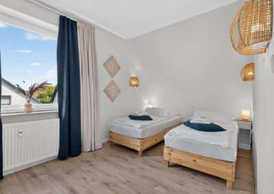 Schlafzimmer mit zwei Einzelbetten in einer Wohnung in Kaarst